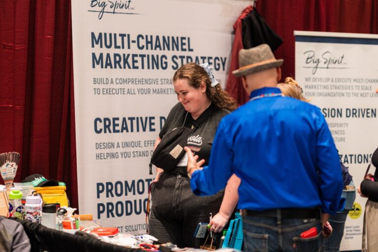 branded trade show promotional items arranged on a display table