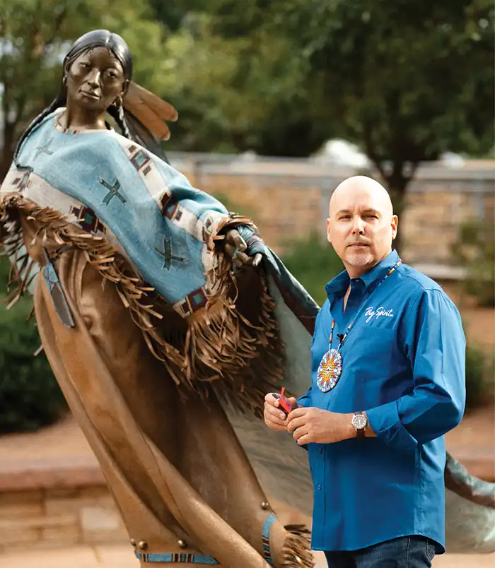 Big Spirit Inc owner Shanne with statue