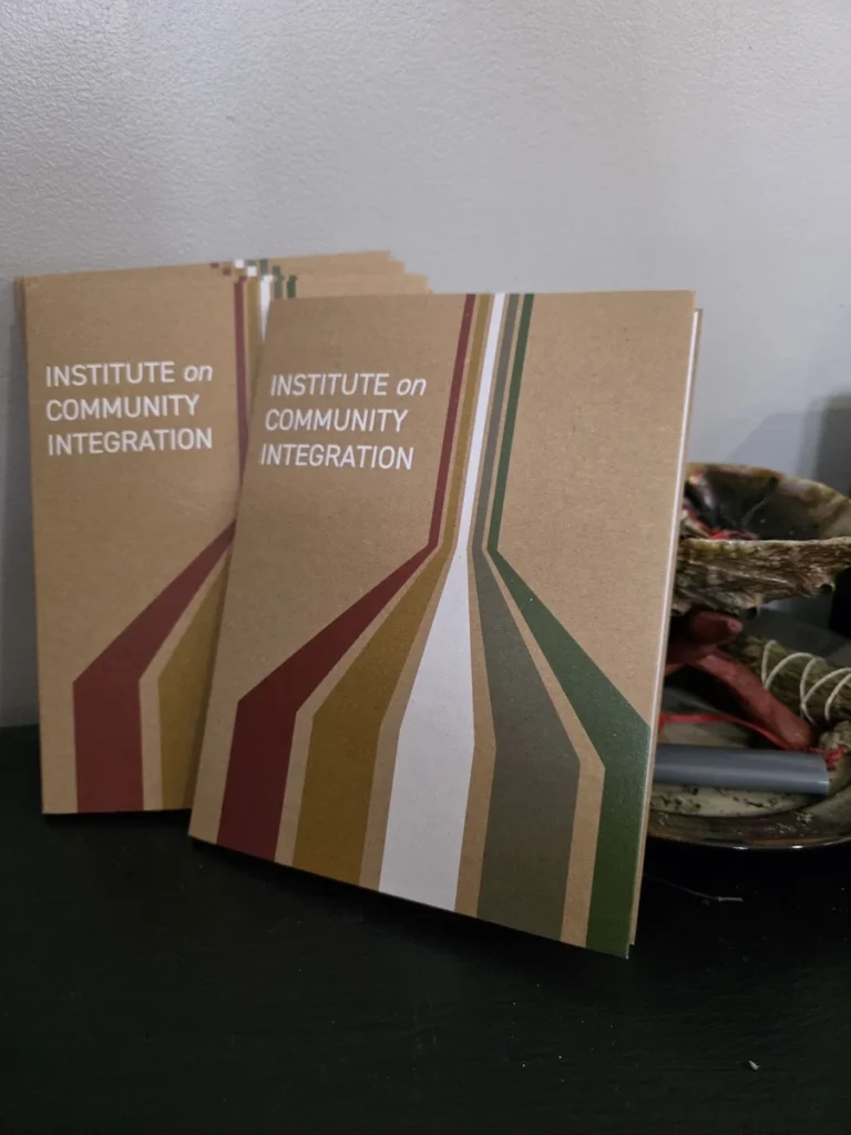 A custom-fabricated notepad folder constructed from recycled materials